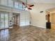 Bright living room with built-in shelving and neutral tones, offering a versatile space at 211 Crown Oaks Way, Longwood, FL 32779