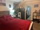 Bedroom with bed and mini-fridge perfect as a guest suite or as a rental room at 31517 Broadwater Ave, Leesburg, FL 34748