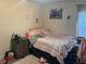 Cozy bedroom with personalized decor and a comfortable bed perfect for relaxation at 31517 Broadwater Ave, Leesburg, FL 34748