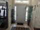 Inviting entryway with neutral tones and a decorative plant adds a welcoming touch to this home at 31517 Broadwater Ave, Leesburg, FL 34748