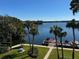 Expansive lake view with private boat docks and lush greenery, perfect for waterfront living at 690 Osceola Ave # 405, Winter Park, FL 32789