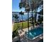 Lakeside pool with dock access providing relaxing views and recreational opportunities at 690 Osceola Ave # 405, Winter Park, FL 32789