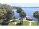Waterfront property with lush landscaping and direct access to the serene lake and boat docks at 690 Osceola Ave # 405, Winter Park, FL 32789