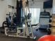 Community gym with weight machines, treadmill, free weights, and bright windows at 690 Osceola Ave # 405, Winter Park, FL 32789