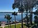 Scenic lake view showcasing docks and water access surrounded by mature trees at 690 Osceola Ave # 405, Winter Park, FL 32789