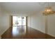 Bright living room with hardwood floors and expansive windows offering scenic views at 690 Osceola Ave # 405, Winter Park, FL 32789
