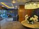 Well-lit community lobby with chandelier, seating, and seasonal Christmas tree at 690 Osceola Ave # 405, Winter Park, FL 32789