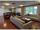 Bright community lounge with couches, tables, chairs, and access to an outdoor patio at 690 Osceola Ave # 405, Winter Park, FL 32789