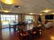 Spacious community lounge with large dining and living areas overlooking outdoor patio at 690 Osceola Ave # 405, Winter Park, FL 32789