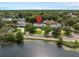 Aerial view of a home featuring lake frontage at 1410 Poinsettia Ave, Orlando, FL 32804
