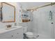 Modern bathroom featuring a glass-enclosed shower, white vanity with sleek fixtures, and ample storage space at 1410 Poinsettia Ave, Orlando, FL 32804