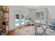 Bright bedroom with french doors to the pool and a decorative white wood bed frame at 1410 Poinsettia Ave, Orlando, FL 32804