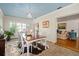Charming dining room with ample natural light, a wooden table, and seating for six, ideal for Gathering meals at 1410 Poinsettia Ave, Orlando, FL 32804