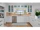 Bright kitchen with white cabinets, modern appliances, and a view of the water at 1410 Poinsettia Ave, Orlando, FL 32804
