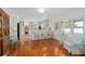 Bright, open kitchen features white cabinets, granite countertops, and a cozy breakfast bar with counter seating at 1410 Poinsettia Ave, Orlando, FL 32804
