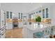 Well-equipped kitchen with white cabinets and a central island with bar seating at 1410 Poinsettia Ave, Orlando, FL 32804