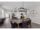 Dining area with view into kitchen, featuring pendant lights and quartz countertops at 1896 Napoli Dr, St Cloud, FL 34771