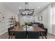 Dining area open to living room features stylish furnishings and modern finishes at 1896 Napoli Dr, St Cloud, FL 34771
