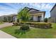 Picturesque home with lush landscaping and a well-maintained lawn offering great curb appeal at 1896 Napoli Dr, St Cloud, FL 34771