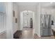 Welcoming foyer with hardwood floors, natural light, and access to the kitchen at 1896 Napoli Dr, St Cloud, FL 34771
