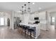 Bright, open kitchen features a large center island, stainless steel appliances, and modern pendant lighting at 1896 Napoli Dr, St Cloud, FL 34771