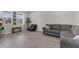 Inviting living room with tile floors, neutral paint and plenty of natural light at 1896 Napoli Dr, St Cloud, FL 34771
