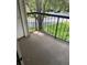 Private balcony overlooking lush greenery, offering a tranquil outdoor space at 1948 Lake Atriums Cir # 132, Orlando, FL 32839