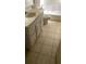 This bathroom features a bright vanity with ample storage and a toilet at 1948 Lake Atriums Cir # 132, Orlando, FL 32839