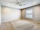 Large carpeted bedroom with a ceiling fan and a window with blinds at 2641 Delcrest Dr, Orlando, FL 32817