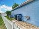 Side view of light blue home with white picket fence at 2641 Delcrest Dr, Orlando, FL 32817