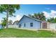 Blue siding and a well-maintained backyard with a shed offering ample storage space at 2641 Delcrest Dr, Orlando, FL 32817