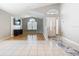 Open-concept living room with tile and wood flooring, natural light, and neutral paint at 2641 Delcrest Dr, Orlando, FL 32817