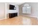 Bright living room featuring hardwood floors, modern decor, and an abundance of natural light at 2641 Delcrest Dr, Orlando, FL 32817