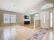 Bright and spacious living room featuring tile and hardwood floors, large windows and modern decor at 2641 Delcrest Dr, Orlando, FL 32817