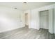 Cozy bedroom with modern flooring, closet, and updated lighting at 7331 Blue Jacket W Pl, Winter Park, FL 32792