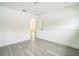 This bright bedroom features clean white paint, sleek flooring, and ample closet space at 7331 Blue Jacket W Pl, Winter Park, FL 32792