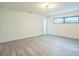 Clean, freshly painted bedroom with modern floors and a window, creating a bright and inviting space at 7331 Blue Jacket W Pl, Winter Park, FL 32792