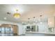 Open kitchen features stainless steel appliances and elegant pendant lighting, ideal for entertaining at 7331 Blue Jacket W Pl, Winter Park, FL 32792