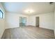 Bright living room features sleek flooring, fresh paint, and ample natural light at 7331 Blue Jacket W Pl, Winter Park, FL 32792
