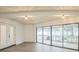 Bright living space with sliding glass doors and neutral paint at 7331 Blue Jacket W Pl, Winter Park, FL 32792