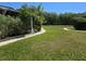 Expansive front yard with lush green grass and well-maintained landscaping, offering a serene outdoor space at 4213 E Michigan St # 4213, Orlando, FL 32812