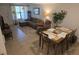 Comfortable living area with a sectional sofa, recliner, and a dining table at 4213 E Michigan St # 4213, Orlando, FL 32812