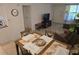 Inviting living room and dining area with coordinated furniture and ample natural light at 4213 E Michigan St # 4213, Orlando, FL 32812