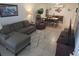 Open-concept living room and dining area with stylish decor and comfortable seating arrangements at 4213 E Michigan St # 4213, Orlando, FL 32812