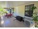 Cozy patio space with outdoor seating, a storage box, and easy access to the home's interior at 4213 E Michigan St # 4213, Orlando, FL 32812