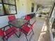 Inviting outdoor patio featuring a dining table and chairs, perfect for enjoying the weather at 4213 E Michigan St # 4213, Orlando, FL 32812