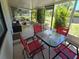 Relaxing patio with a dining table and chairs, providing a comfortable outdoor living space at 4213 E Michigan St # 4213, Orlando, FL 32812