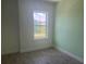 Cozy bedroom featuring bright green walls and a light-filled window at 3069 Caribbean Soul Dr, Kissimmee, FL 34747