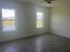 Bedroom with two bright windows overlooking the lake and community at 3069 Caribbean Soul Dr, Kissimmee, FL 34747
