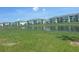 Apartment building exterior showcasing a pond view, landscaped grounds, and a serene setting at 3069 Caribbean Soul Dr, Kissimmee, FL 34747